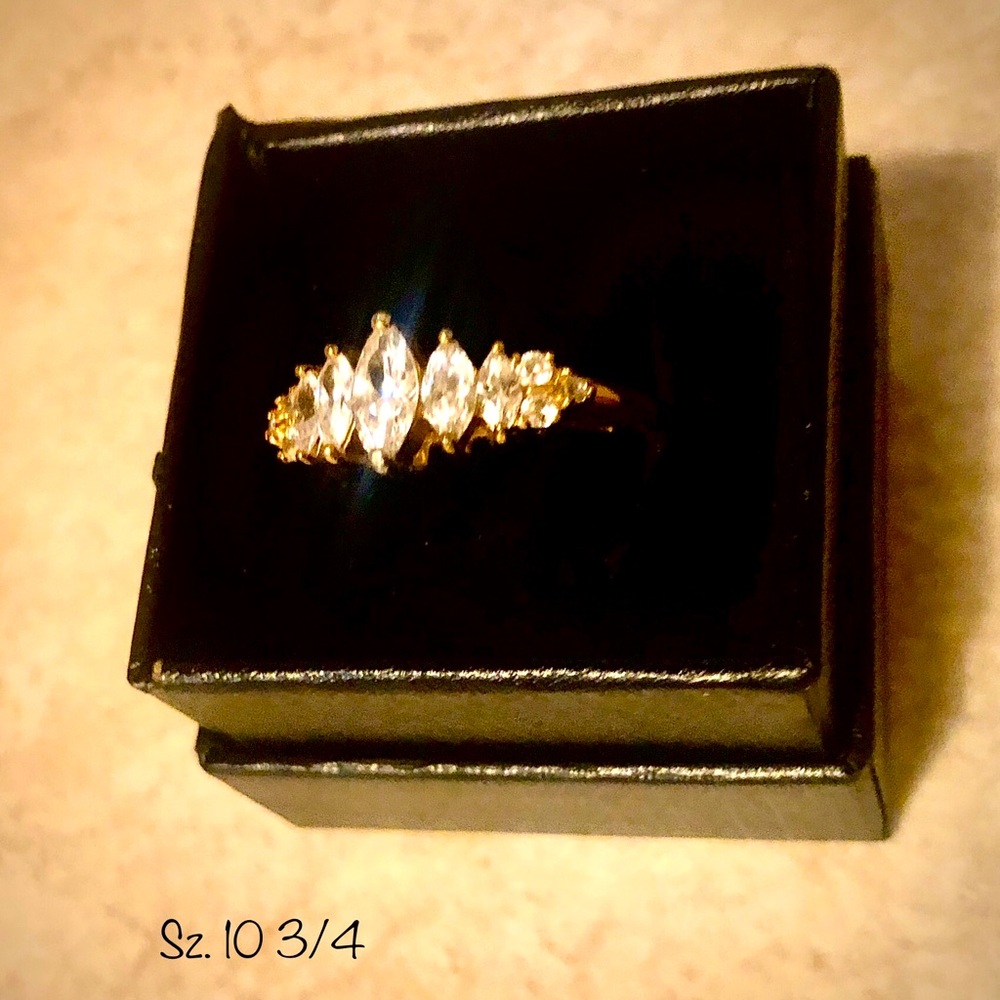 VINTAGE AVON RING ~ MULTIPLE MARQUEE SHAPED FAUX DIAMONDS. 
SHINEY GOLD TONE.